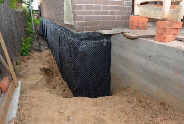 Happy homeowners after waterproofing job in Galesburg